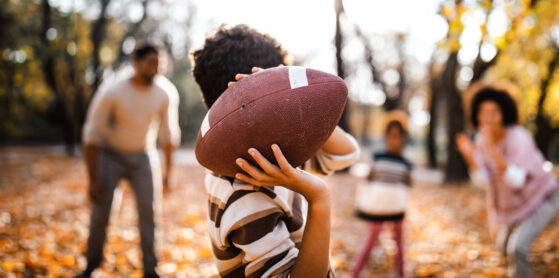 family playing football