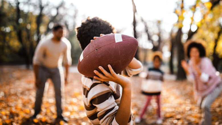 family playing football